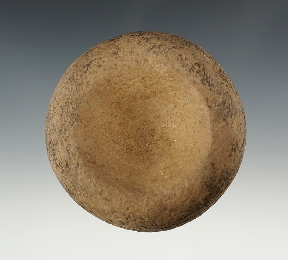 2 5/8" wide Nicely styled Cupped Discoidal. Found in the Midwestern U.S.