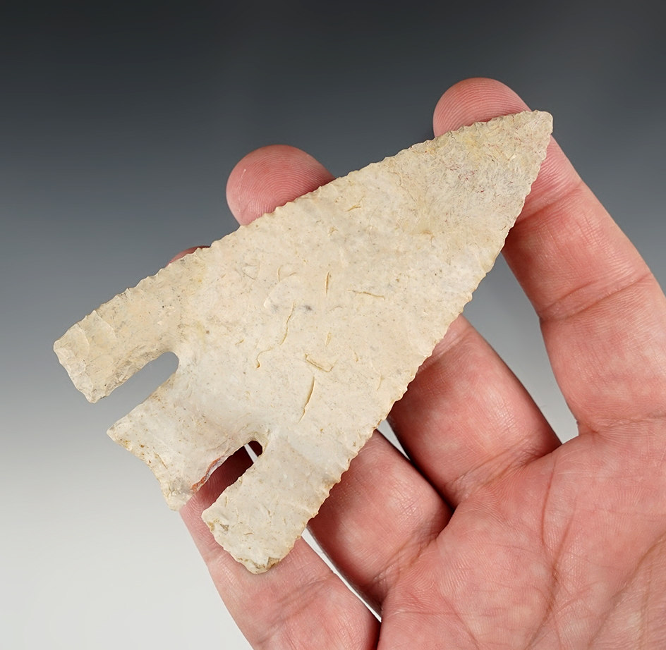 Fine 3 13/16" Calf Creek - Missouri. One barb and an inch of tip has been restored. Rogers COA.