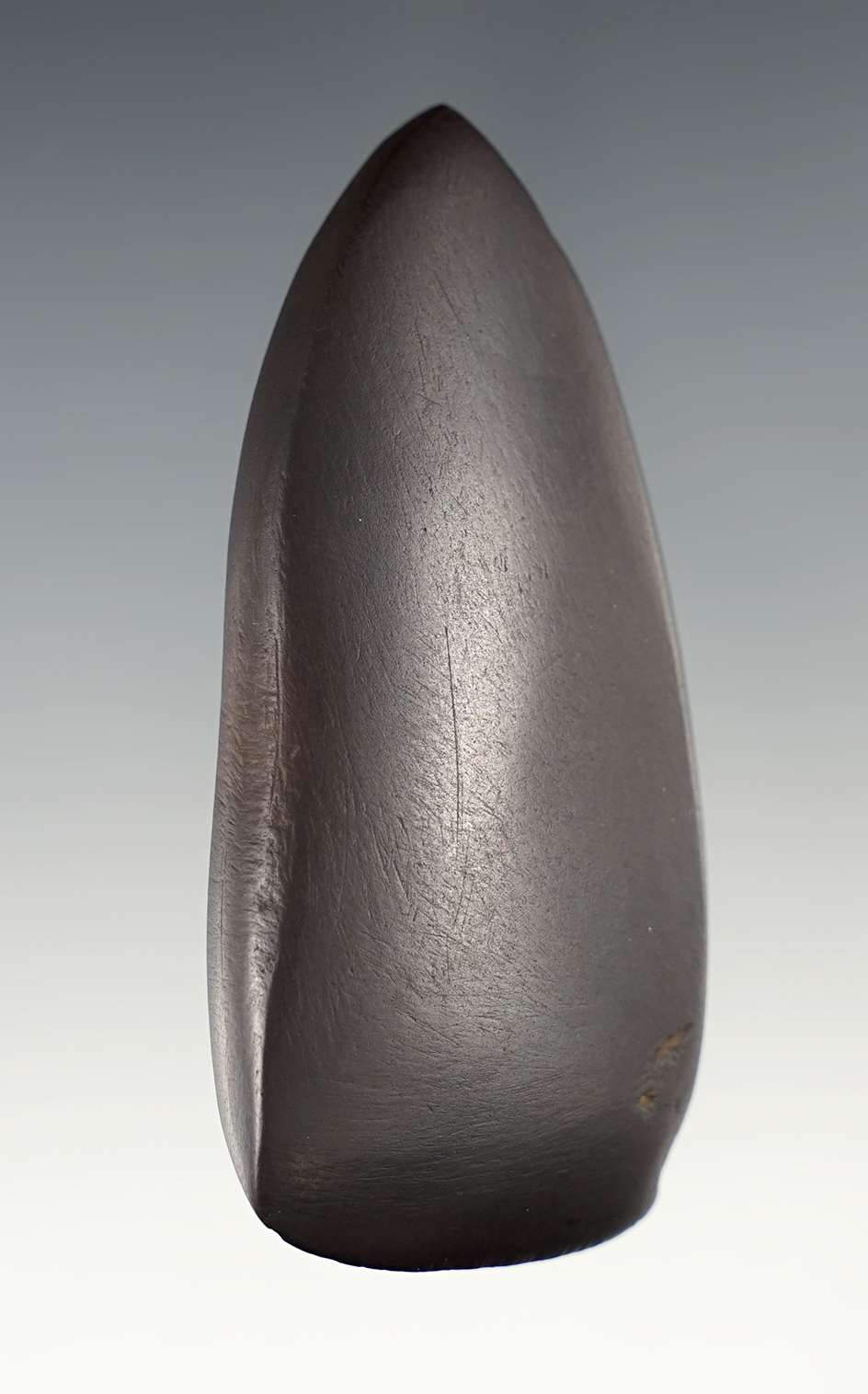 Fine 3" Hematite Celt with a sharp bit. Found in Adams Co., Ohio. Ex. Hooks.