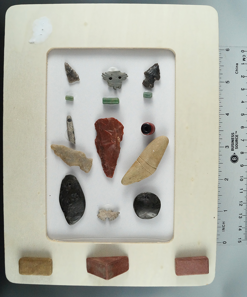 Framed set of artifacts found at a site in Arizona.