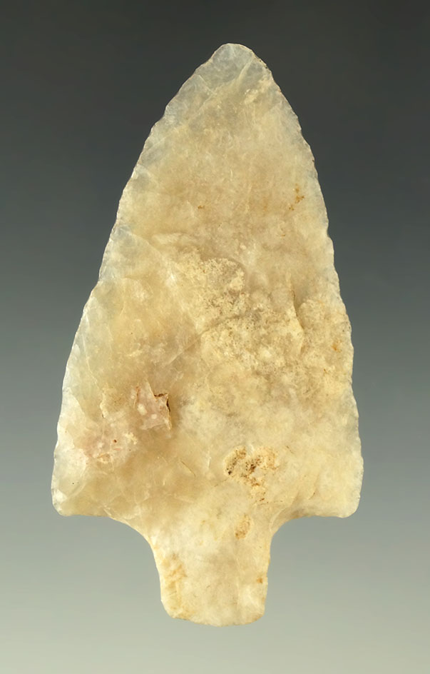 Thin and well patinated 2 3/8" fossilized coral arrowhead found in Hardee County Florida.
