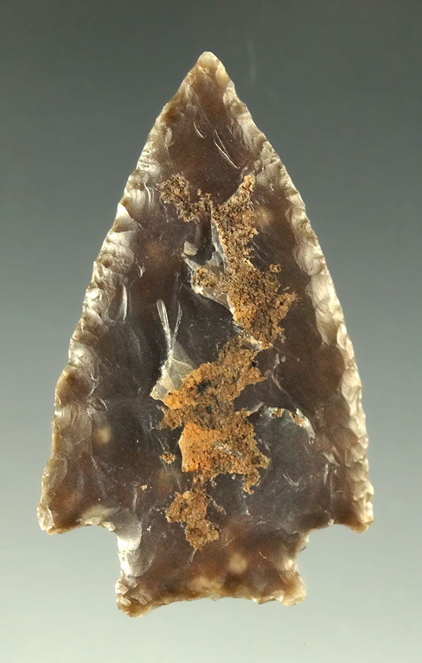 1 3/8" nicely patinated arrowhead found in Sweetwater County Wyoming. Ex. Bob Roth.