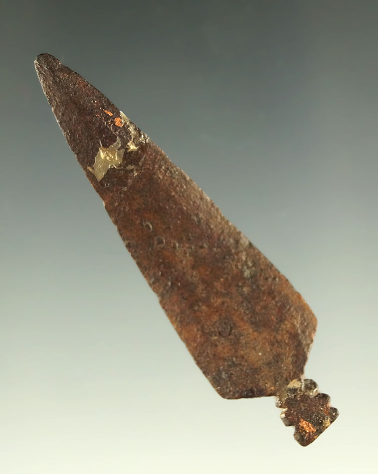 2 3/16" metal trade point that is slightly bent found in the Plains region.