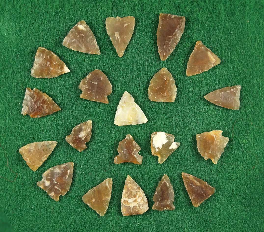 Group of 20 small arrowheads found in the Dakotas, largest is 11/16" Most are Knife River Flint.