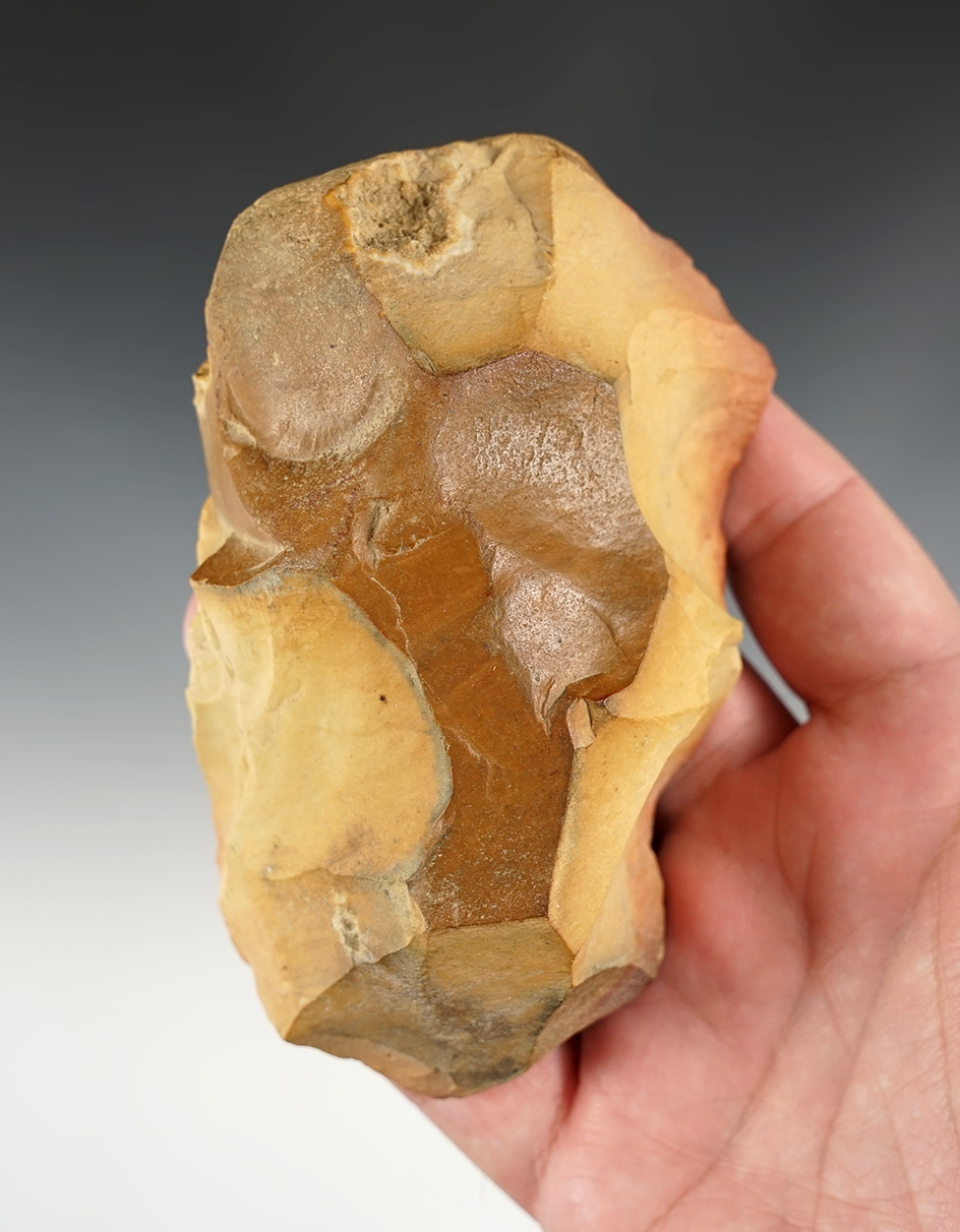 patinated 4 13/16" Mousterian Hand Axe found in Northwest Africa. Comes with a Butler COA.