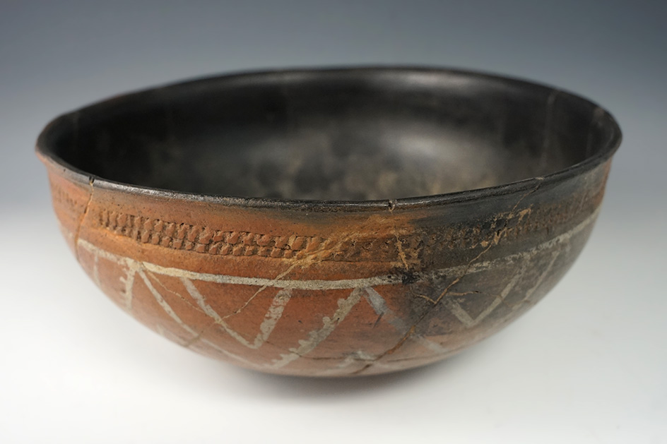 8 3/4" wide x 3 1/2" tall nicely reconstructed pottery vessel with good exterior paint.