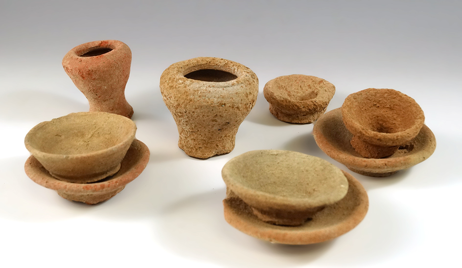 Set of nine miniature Old World Roman pottery artifacts. Largest is 1 7/8" tall.