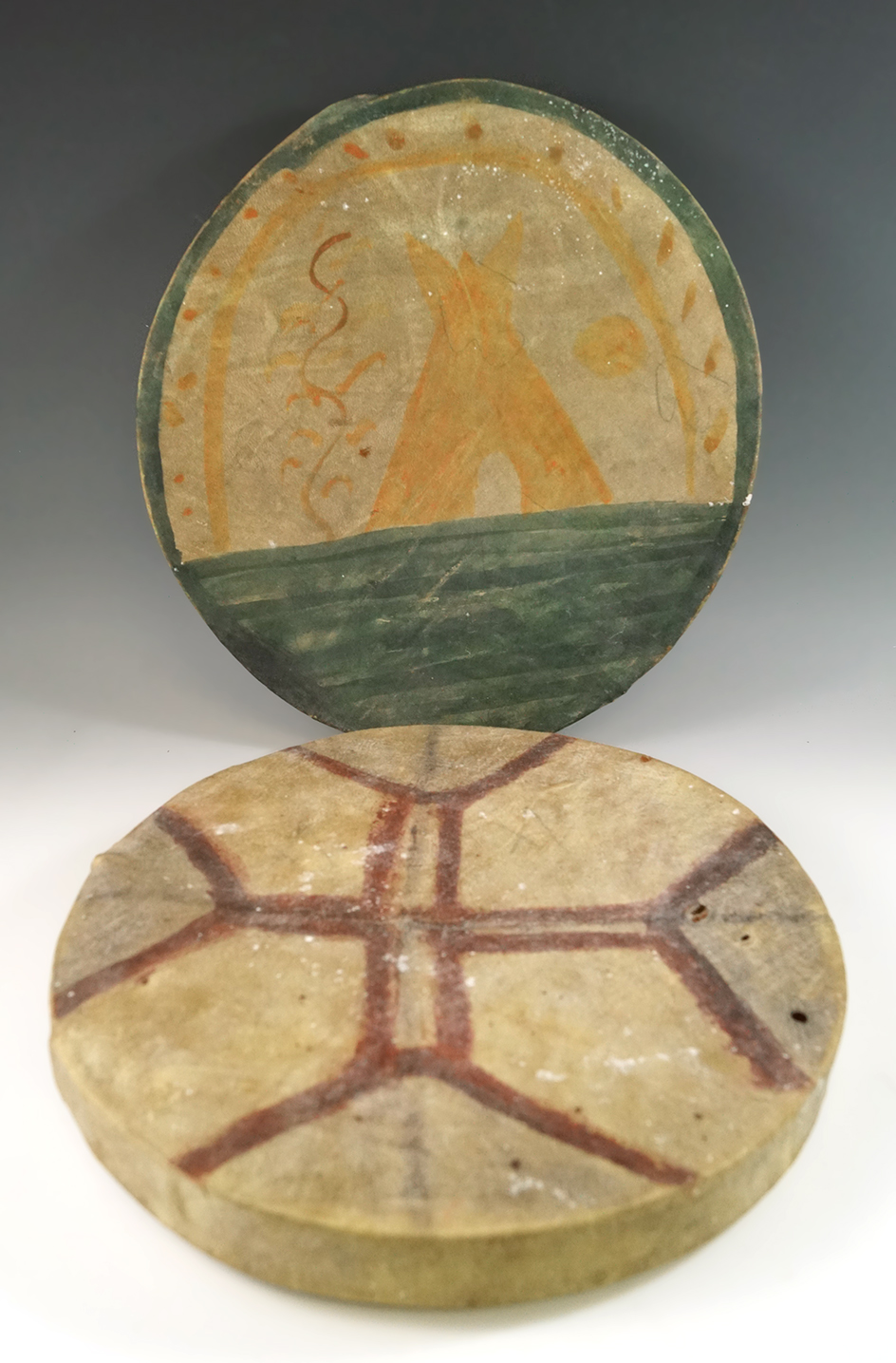 Pair of Cree decorated leather Drums from the Red River area, Manatoba, Canada.