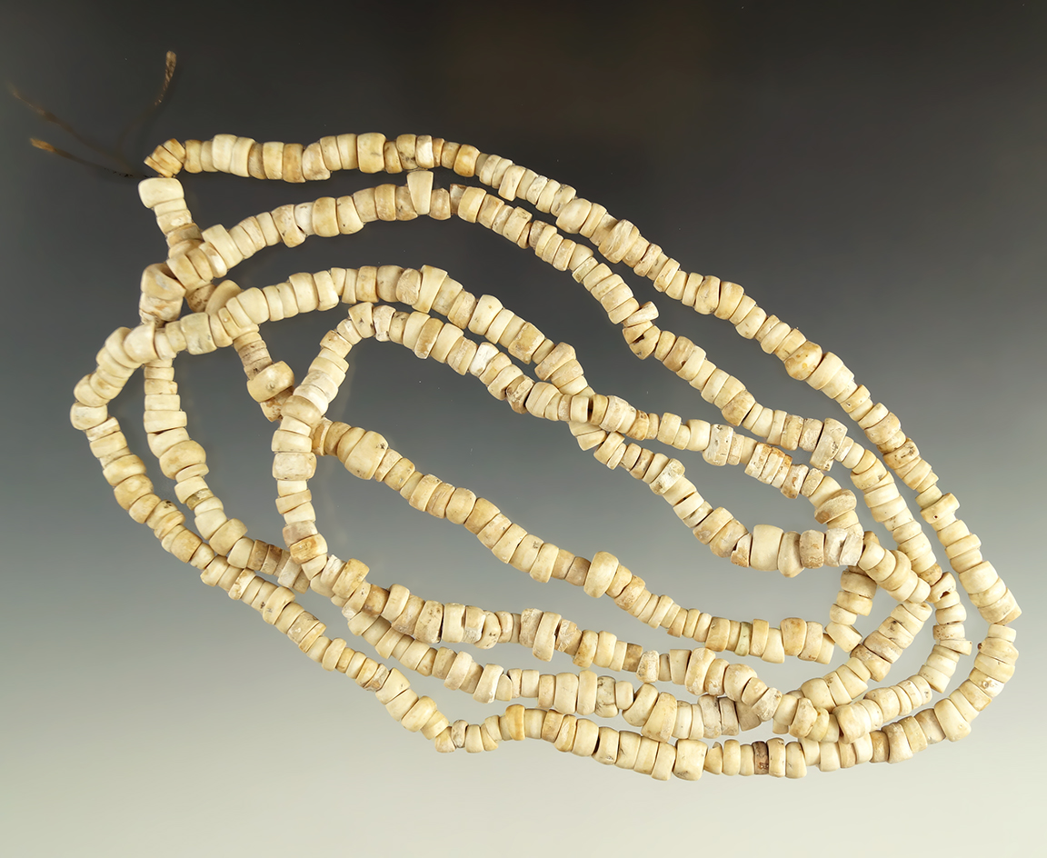 Long 48" strand of drilled stone beads from the collection of Lewis Eulert.