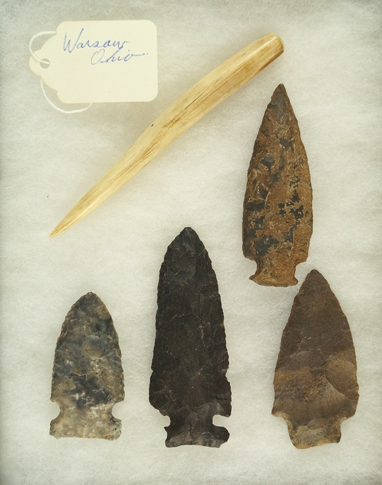 Frame of four arrowheads and a bone awl found near Warsaw Ohio. Largest is 3 3/16".
