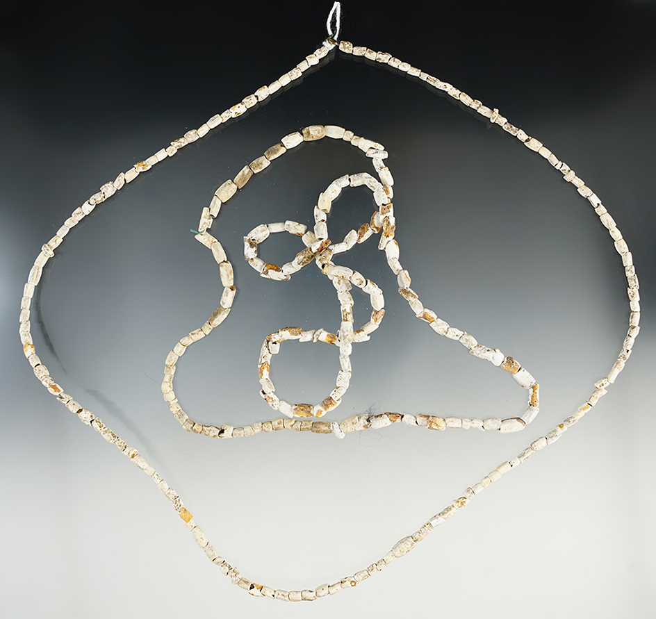 Two very nice strands of old drilled shell beads recovered in Tennessee. 27" and 24" long.