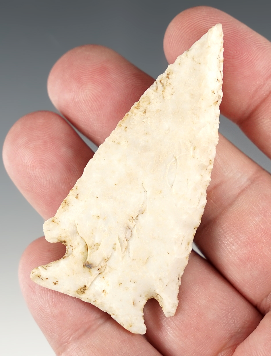 2 3/4" Corner Notch that is beveled with light grinding to the basal area. Jackson Co., Illinois.