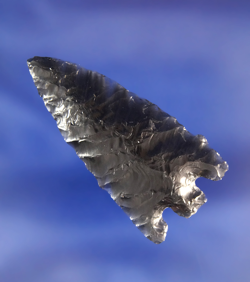 1 7/8" Obsidian Basal Notch that is well flaked. Found in Paradise Valley, Idaho. Ex. Chris Craft.