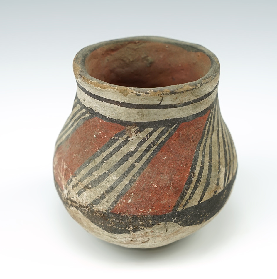 2 1/2" tall miniature Acoma Jar in solid condition.