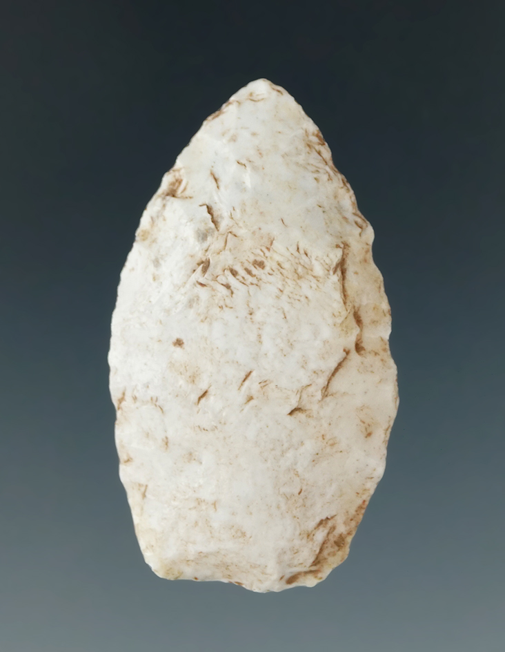 1 1/2" Paleo Lanceolate dart point with heavily ground lower edges found in Utah.