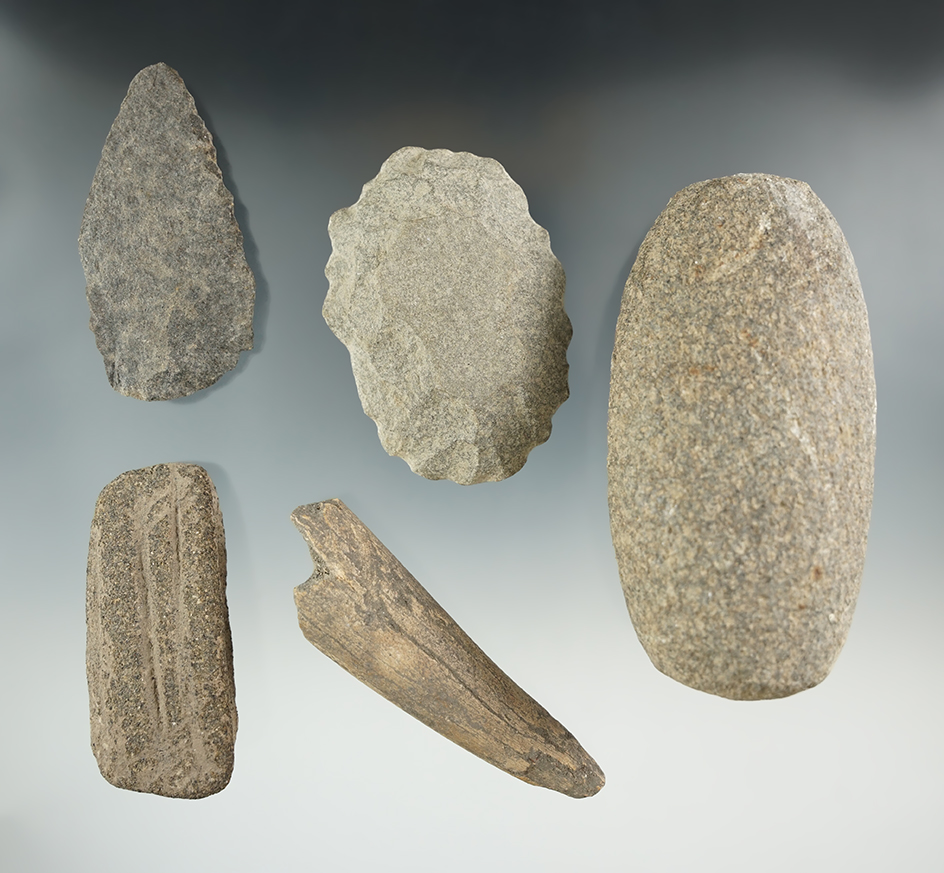 Group of assorted artifacts found in Washington including a Hammerstone, and an abrading stone.