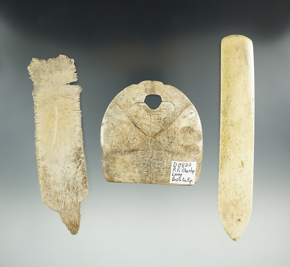 Set of three bone items found in Kentucky including a turtle shell pendant. Largest is 5 3/4".