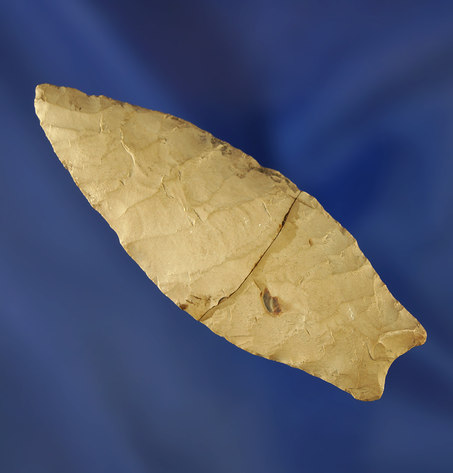 2 5/8" heavily patinated Lovell point that is broken and glued tight at the mid section. Wyoming.