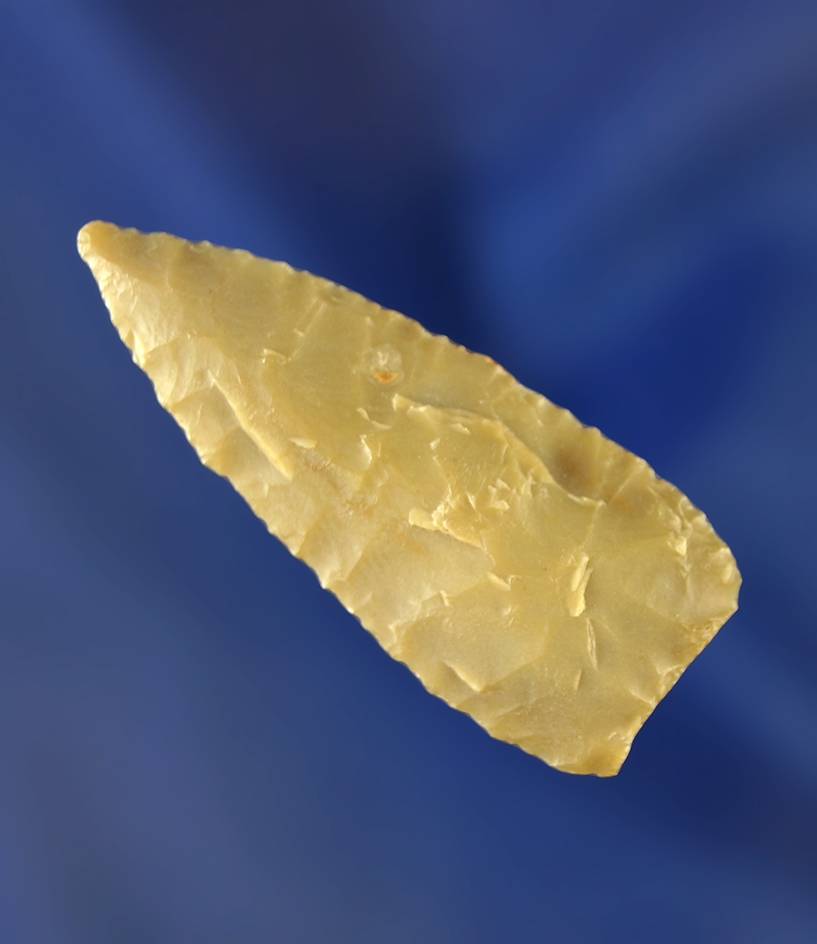 11/16" triangular point that is thin and nicely flaked with a good patina. Wyoming.