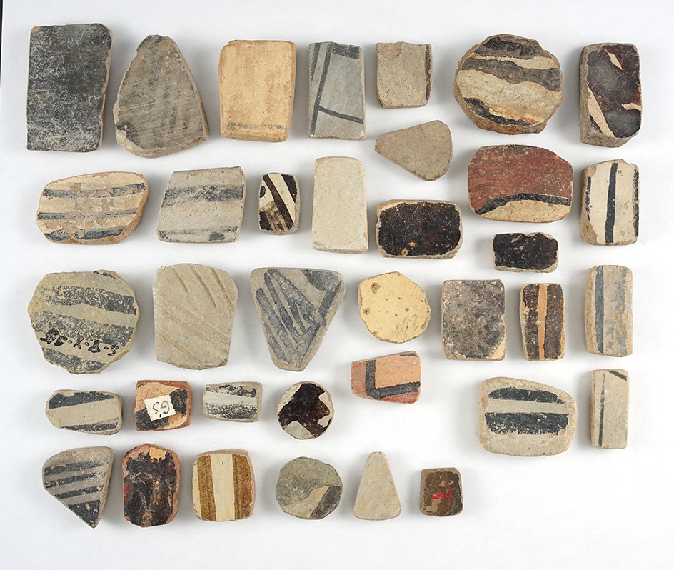 Set of 36 anciently salvaged pottery shards in various shapes. New Mexico. The largest is 2 9/16".