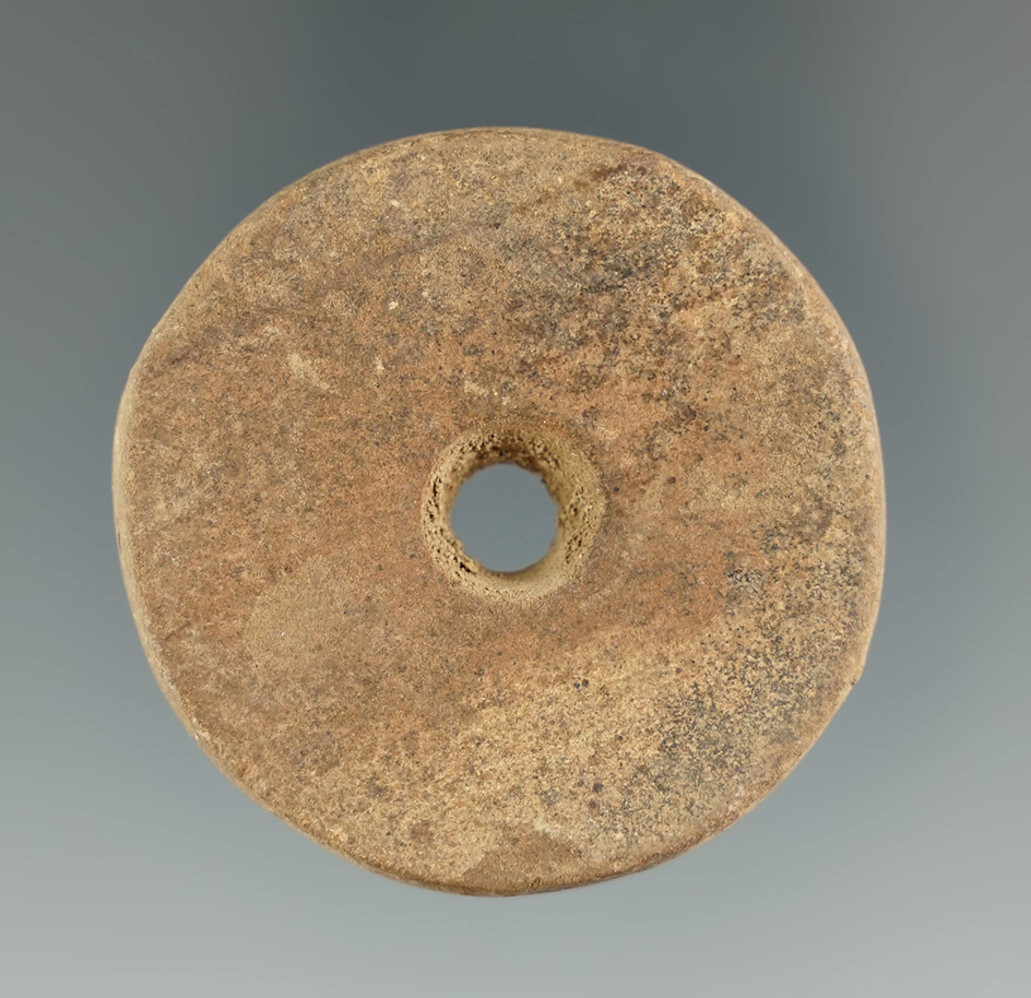 1 5/8" perforated sandstone Discoidal found at the Fox Field site, Mason County Kentucky.
