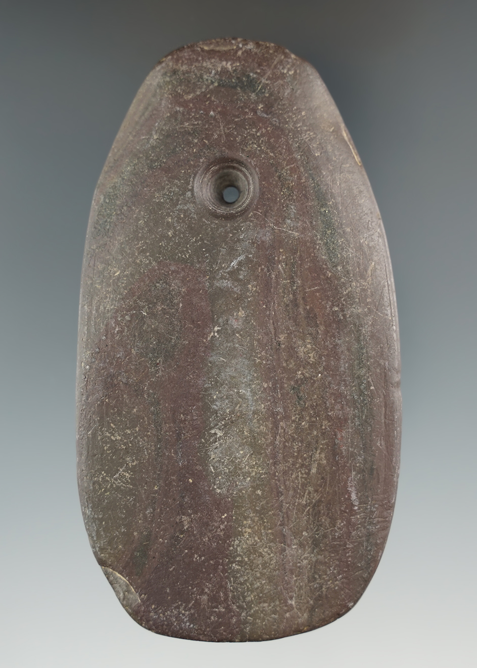 3 3/16" Adena Ovate Pendant made from red and black Slate, found in Marion Co., Indiana.