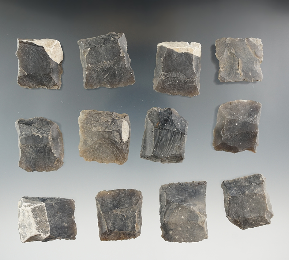 Group of 12 black powder gun flints.