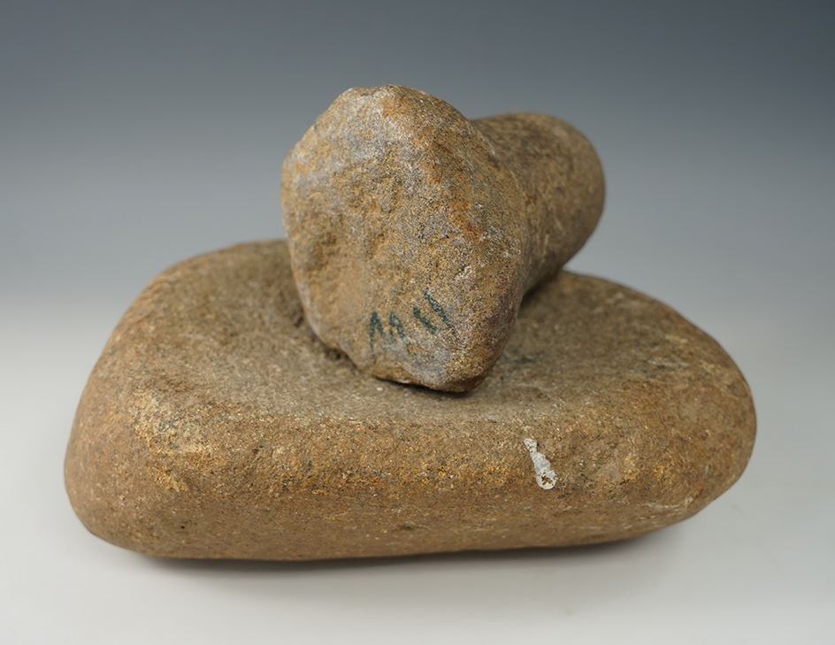 Pestle and grind platform found together at a site in Indiana.  Pestle measures 4 1/4"