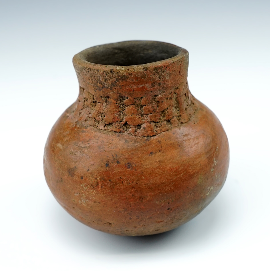 2 3/8" Tall miniature pottery bottle found in New Mexico.