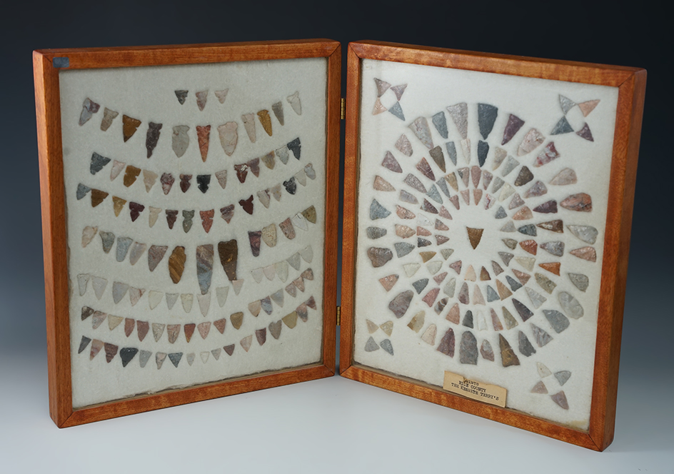 Large framed group in a folding frame of surface found arrowheads found in Rice Co., Kansas.