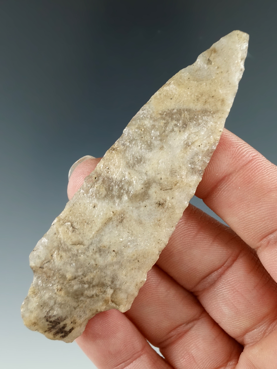 3 3/16" Stemmed point made from Quartzite that is heavily patinated found in New York.