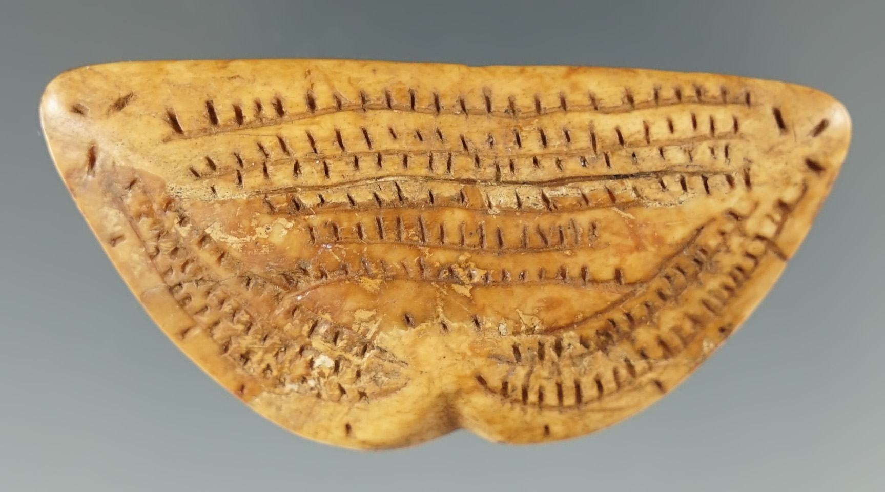 Intricate carving! 2 3/16" very old incised carved ivory ornament found in Alaska.