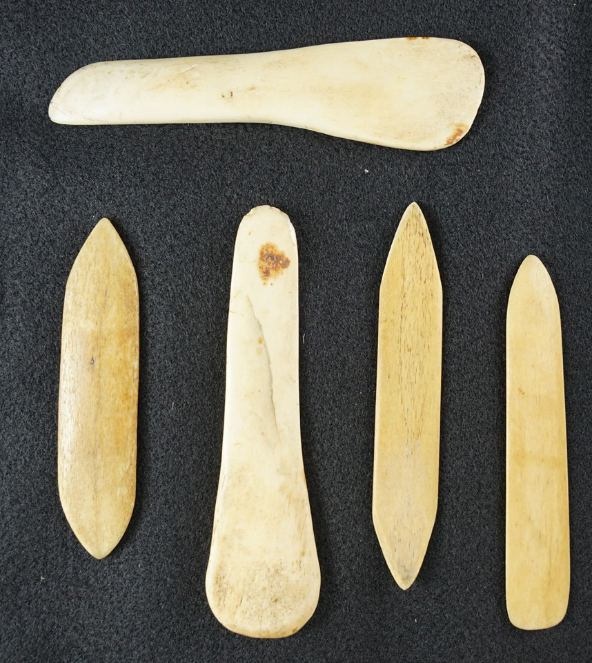 Set of five bone and ivory Inuit artifacts recovered in Alaska, largest is 4 7/8".
