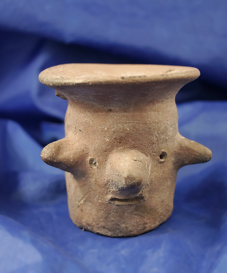 Unique 2 7/8" tall Pre-Columbian pottery item that features a human face.