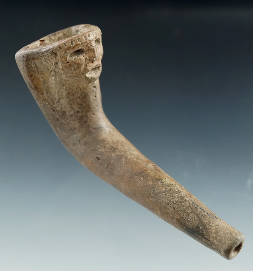 4" Long Iroquois Clay Pipe with a nice human effigy found in New York. Partial restoration to bowl