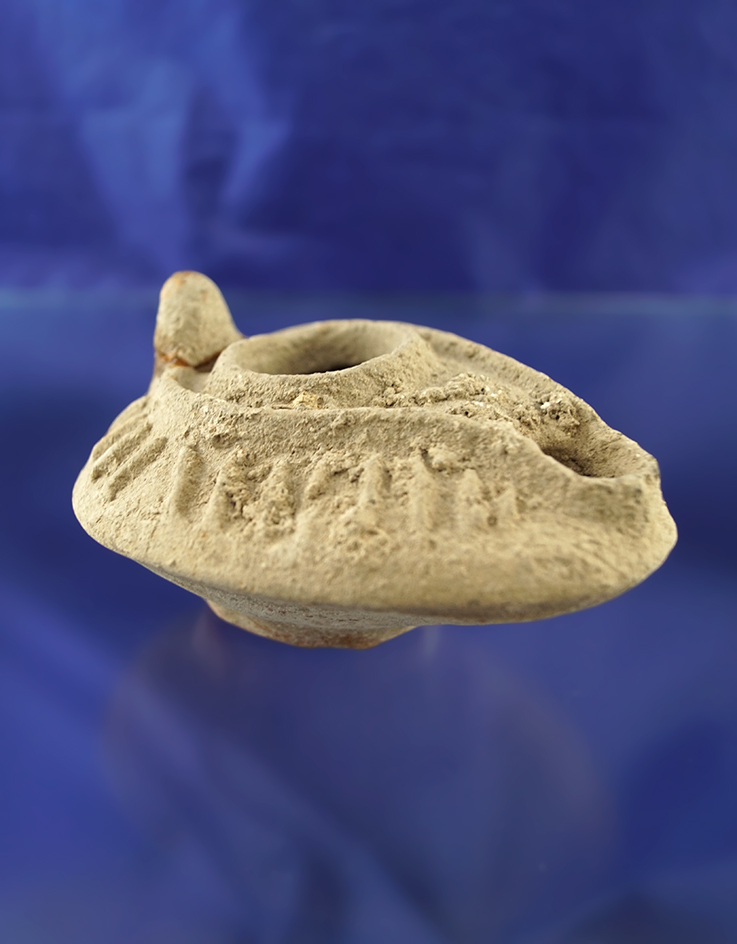 3 1/2" clay holy lands lamp. One small piece is broken and glued.