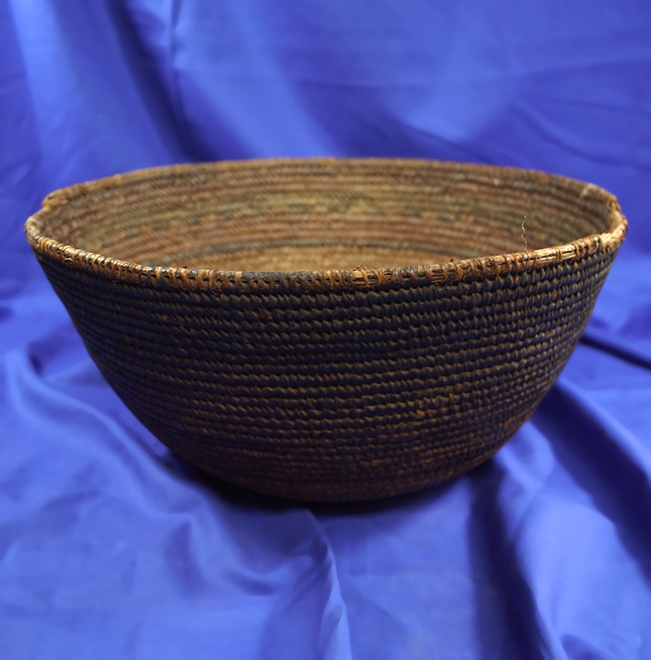 Tightly woven 12" wide basket in nice condition.  This is a period piece.