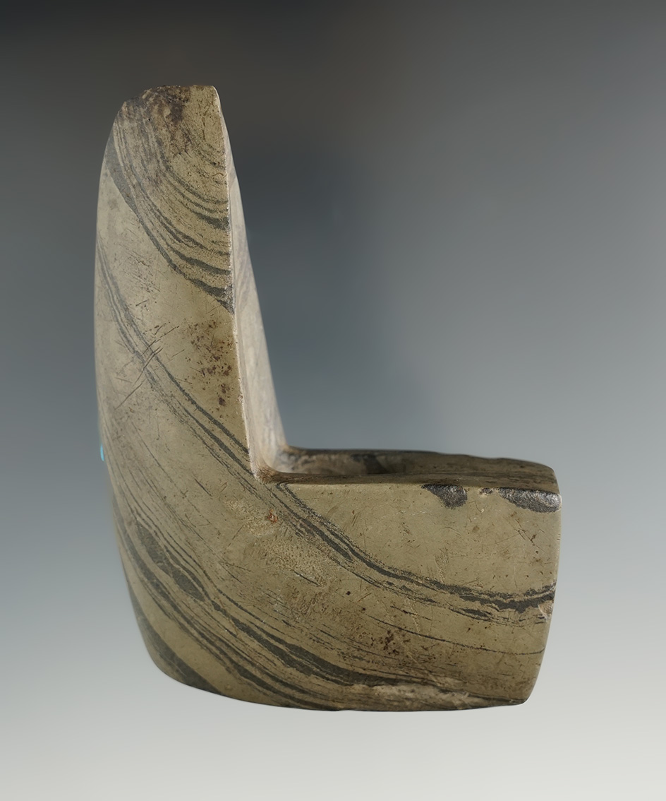 3 1/2" Archaic Geniculate made from green and black Banded Slate, found in DeKalb Co., Indiana. Pict