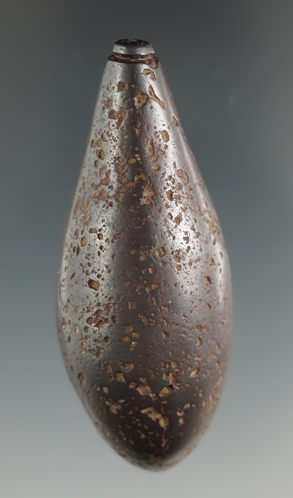 2 1/2" Hematite Grooved Plummet that is very heavily patinated.