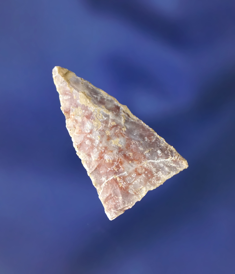 Heavily patinated 1 1/8" Triangular arrowhead found in Colorado.