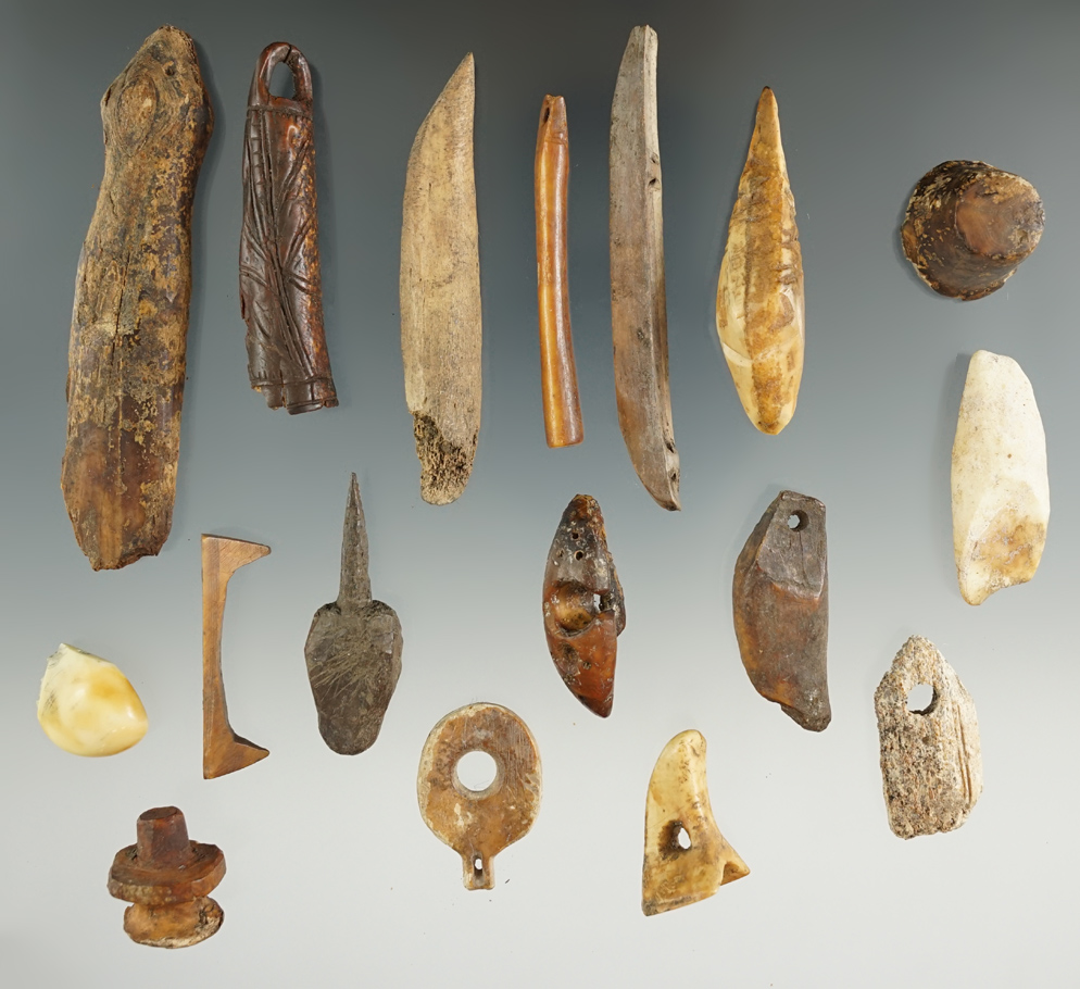 Group of 17 assorted Inuit bone and ivory artifacts, largest is 2 3/4".