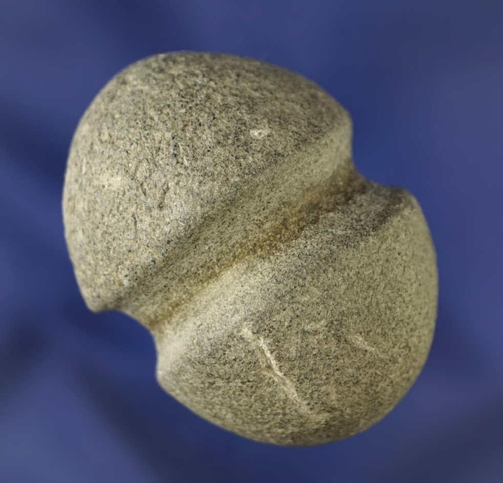 Nicely styled and well-crafted fully grooved 1 7/8" bolo stone or weight found in Southern CA.
