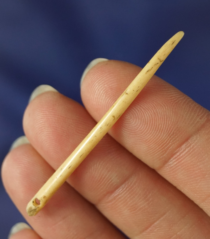 Delicate, nice and rare! 2 1/16" drilled bone needle in excellent condition.  Burns Oregon