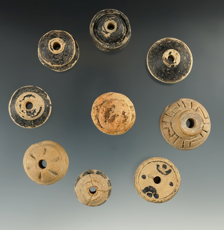 Set of nine nicely colored Spindle Whorls found in Mexico. Largest is 1 5/16" diameter.