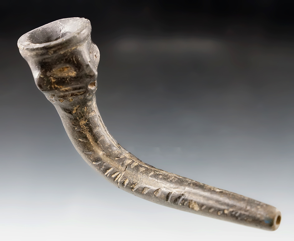 5 1/4" Long Iroquois Clay Face Pipe with restoration to the bowl and rim. Found in New York.