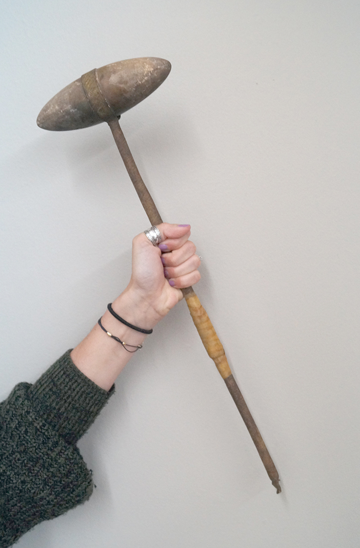 6" stone bi-pointed club head with original leather wrapped wood handle. Handle is broken & taped.