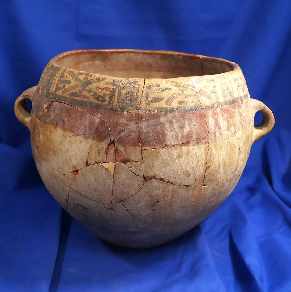 8" wide pre-Columbian pottery vessel that has been glued back together.