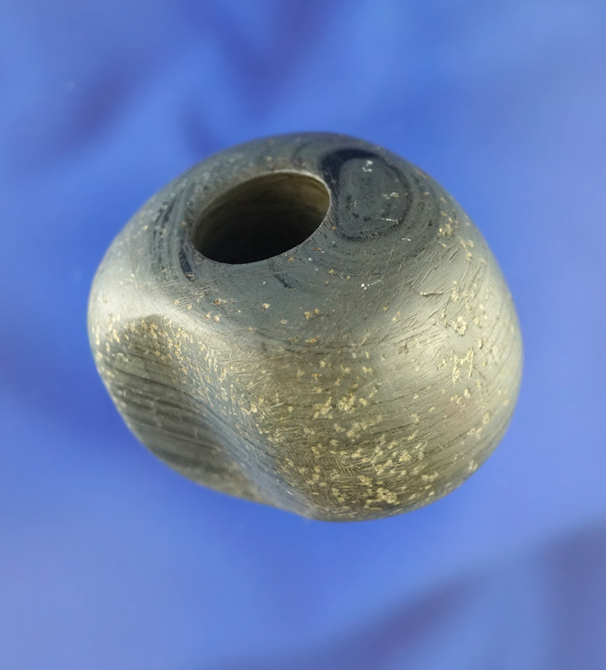 1 5/8" Wide Fluted Ball Bannerstone found in Youngstown, Ohio.   Pictured in Prehistoric American