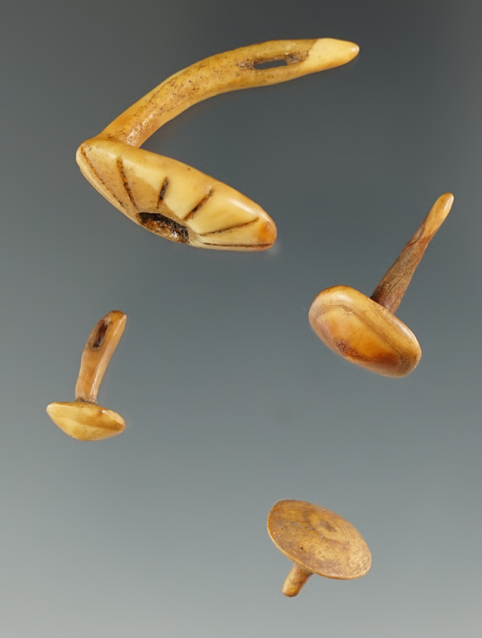 Set of four beautifully carved ivory Inuit ornaments. Largest is 1 1/8".