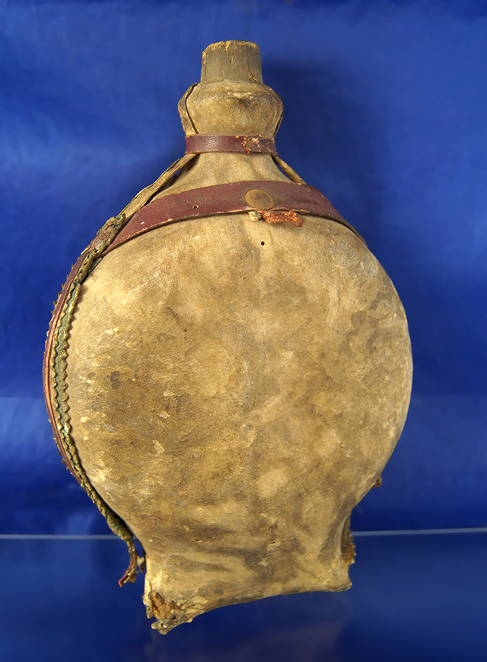 7 7/8" Tall Frontier era wood and leather canteen, fair condition.